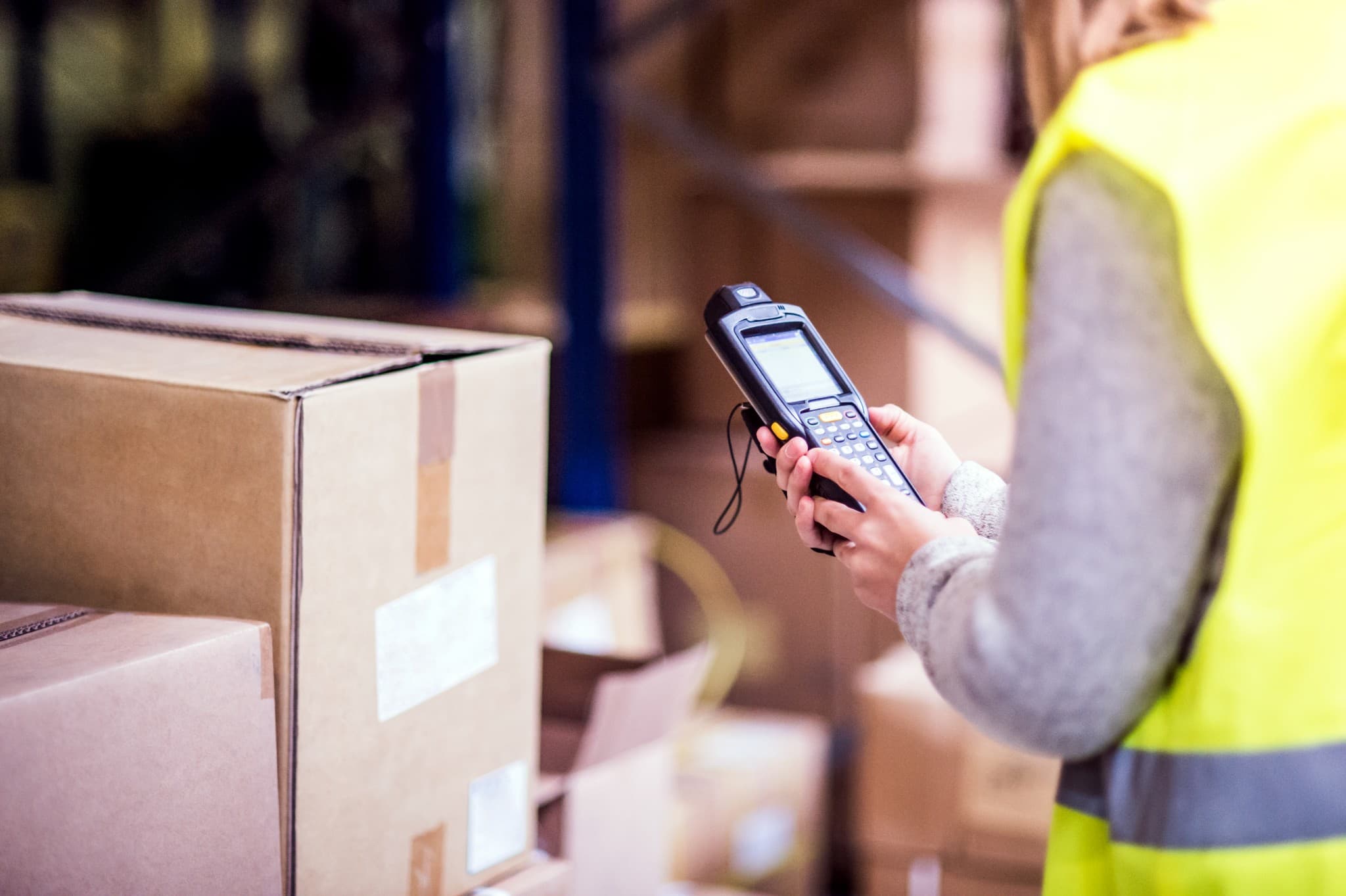 Warehouse worker scanning a barcode during order fulfilment